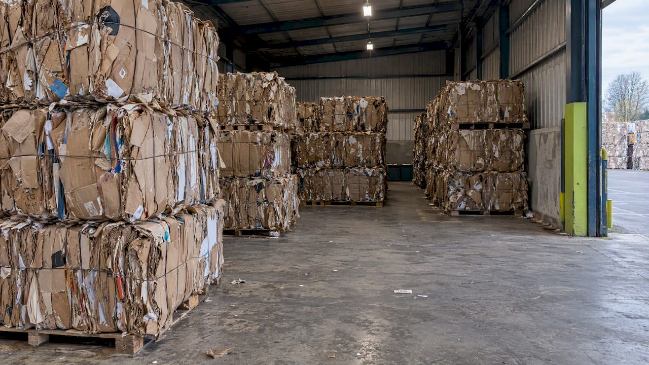 Dry cardboard bales in covered storage